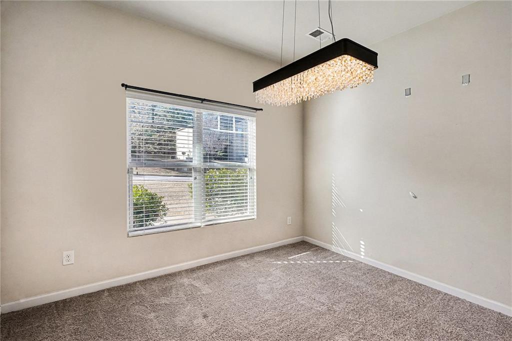11046 Genova Terrace Hampton, GA 30228 - Photo 12 of 38 an empty room with a window