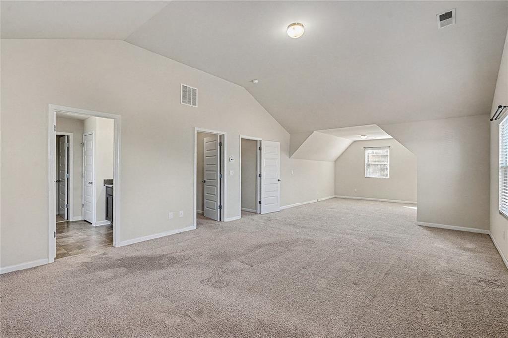 11046 Genova Terrace Hampton, GA 30228 - Photo 16 of 38 a view of a big room with closet and windows