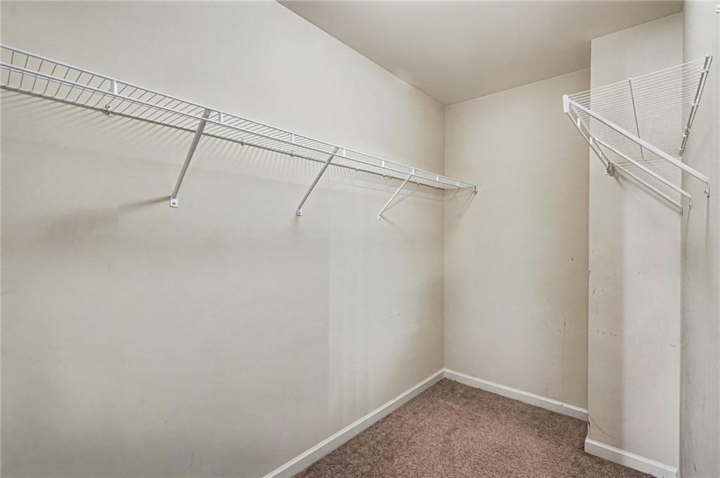 11046 Genova Terrace Hampton, GA 30228 - Photo 18 of 38 a view of a room with racks on the wall