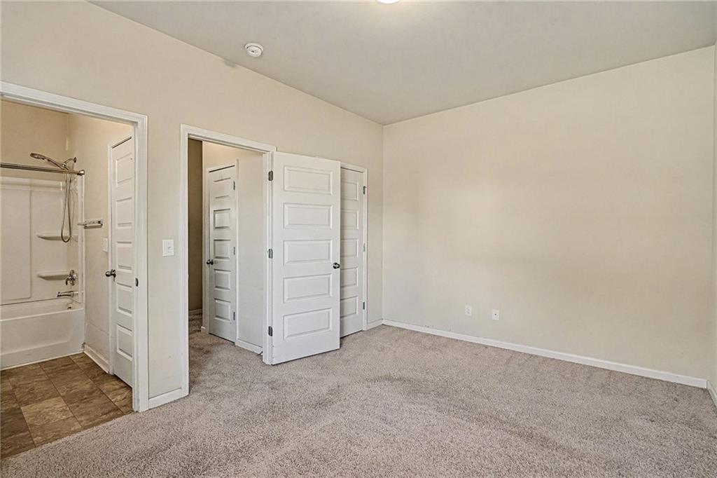 11046 Genova Terrace Hampton, GA 30228 - Photo 21 of 38 an empty room with closet area