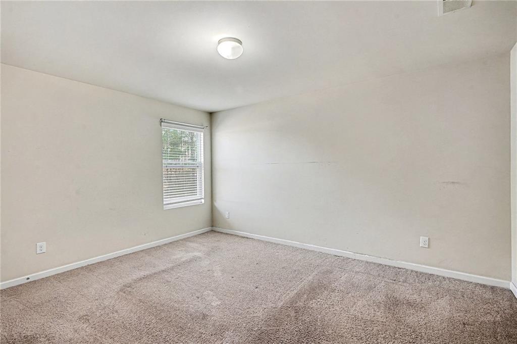 11046 Genova Terrace Hampton, GA 30228 - Photo 26 of 38 an empty room with a window
