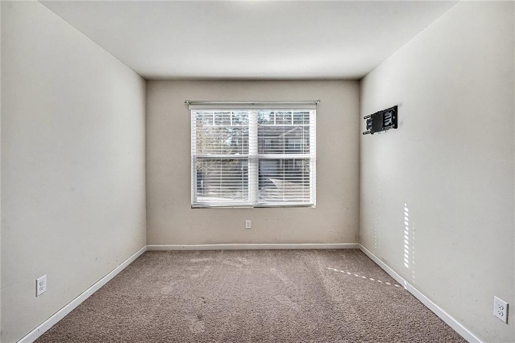 11046 Genova Terrace Hampton, GA 30228 - Photo 30 of 38 an empty room with a window