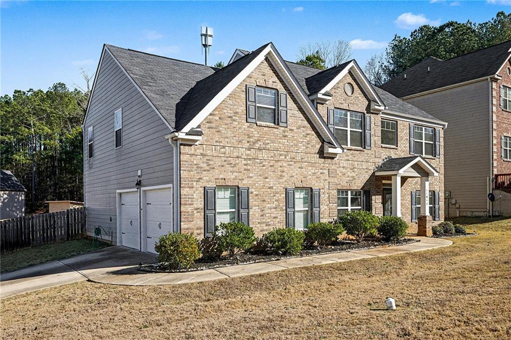 11046 Genova Terrace Hampton, GA 30228 - Photo 3 of 38 a front view of a house with a yard