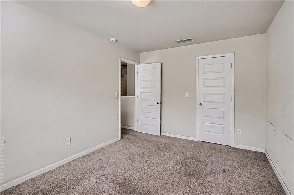 11046 Genova Terrace Hampton, GA 30228 - Photo 31 of 38 an empty room with closet area