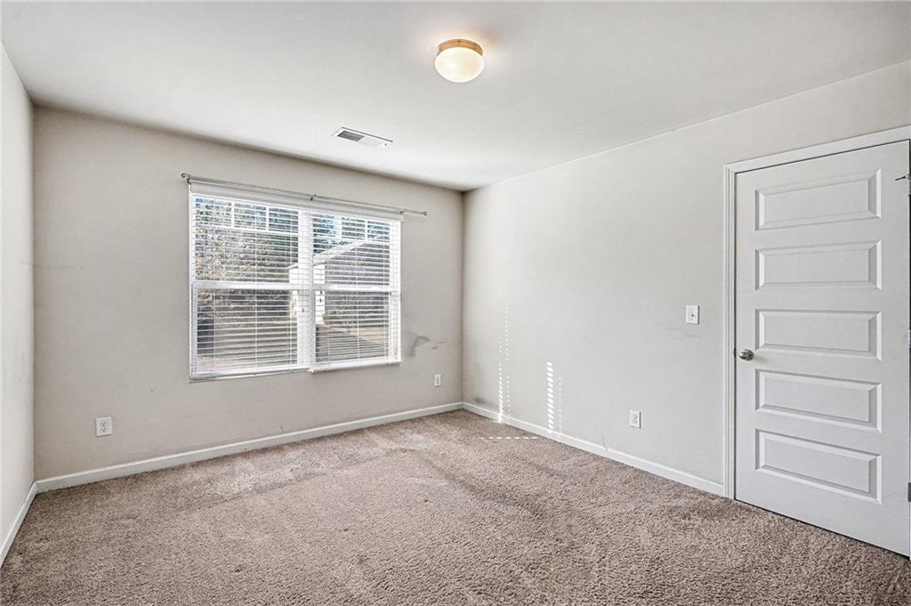 11046 Genova Terrace Hampton, GA 30228 - Photo 32 of 38 an empty room with a window