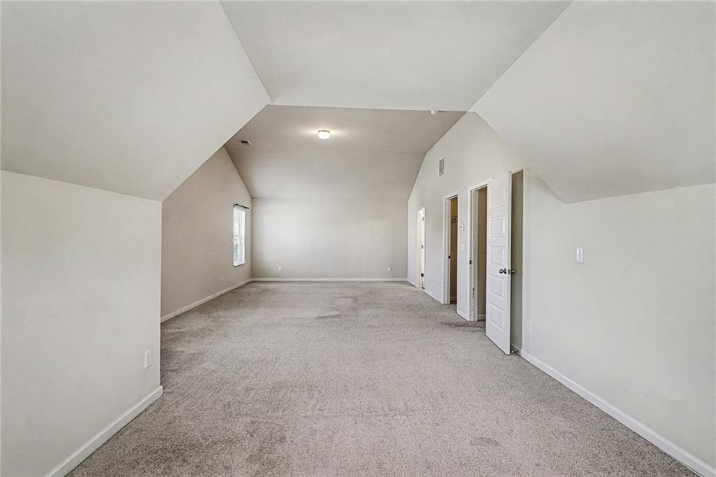 11046 Genova Terrace Hampton, GA 30228 - Photo 34 of 38 an empty room with a empty space and windows