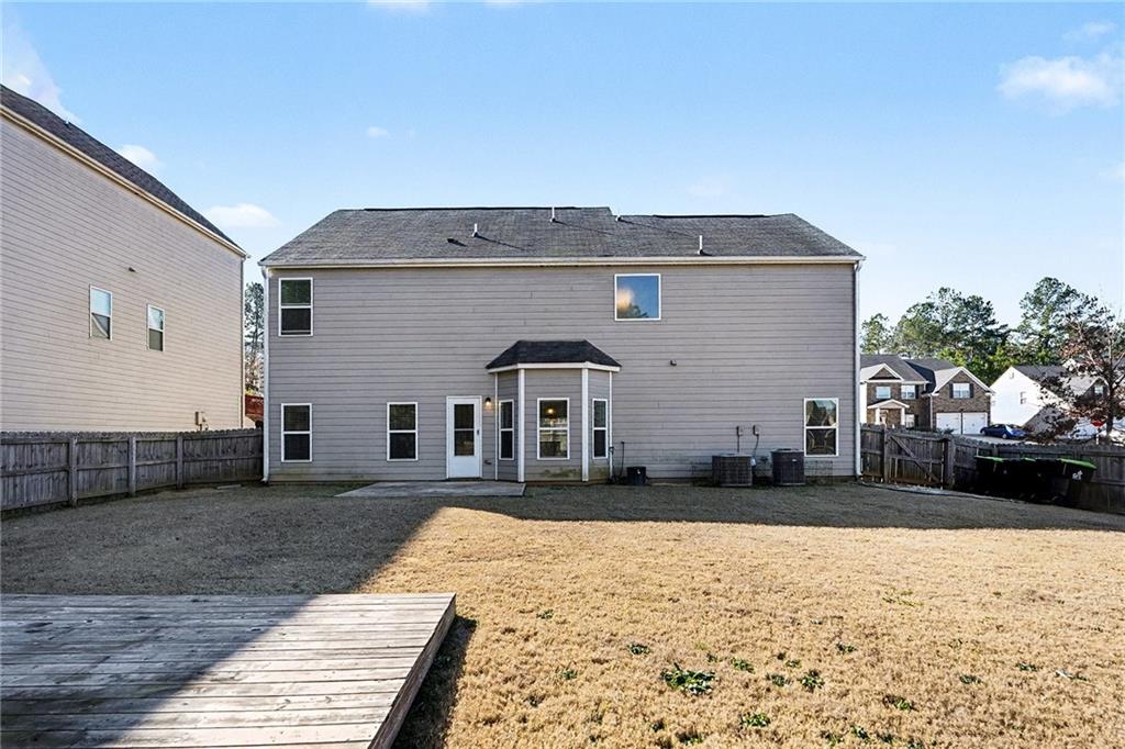 11046 Genova Terrace Hampton, GA 30228 - Photo 37 of 38 a front view of a house with a yard