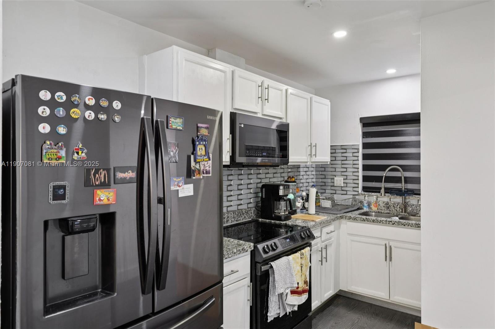 1630 West 46th Street, Unit 208F Hialeah, FL 33012 - Photo 3 of 21 a kitchen with stainless steel appliances a refrigerator stove and microwave