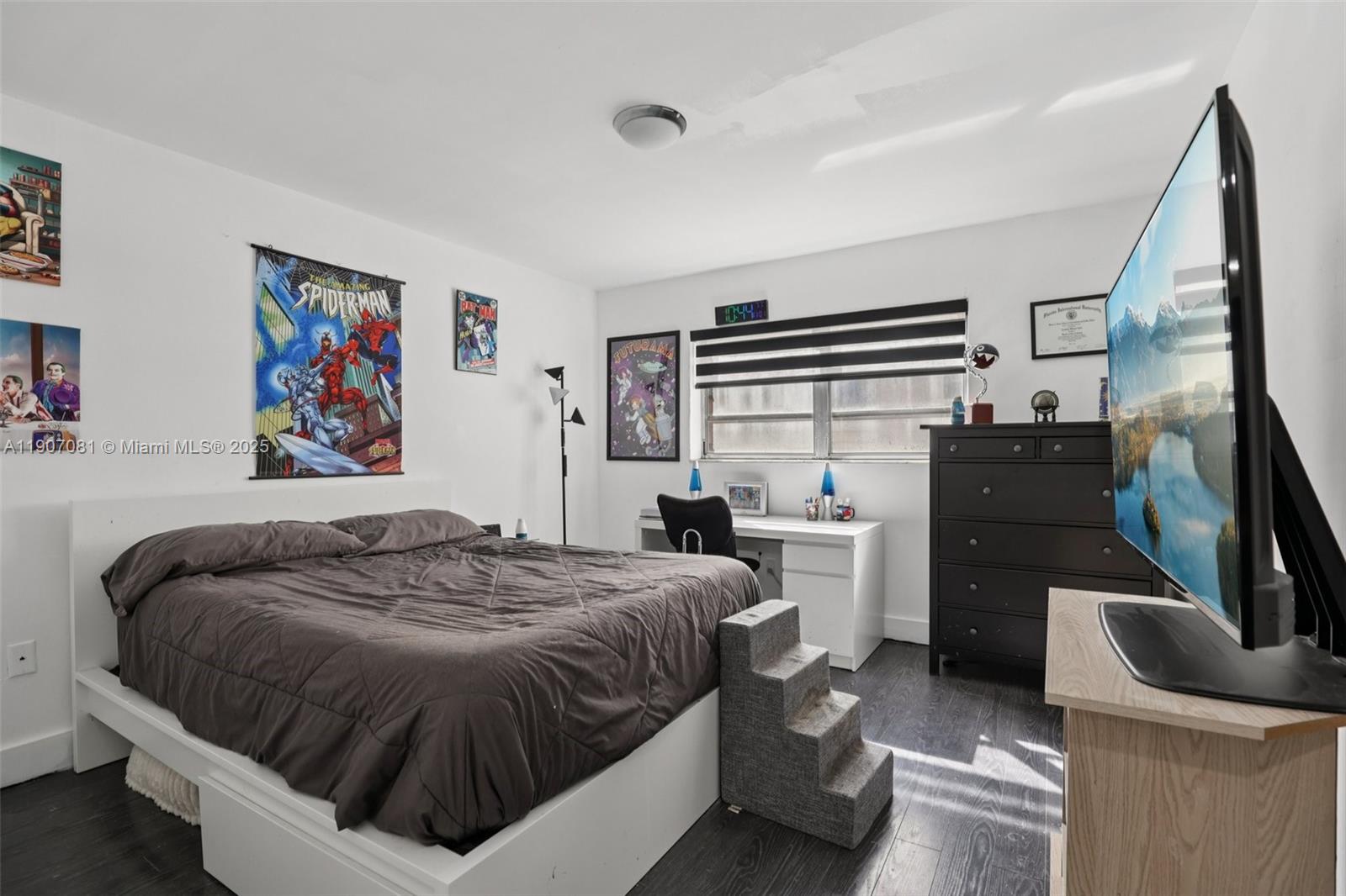 1630 West 46th Street, Unit 208F Hialeah, FL 33012 - Photo 4 of 21 a bedroom with a bed and dresser