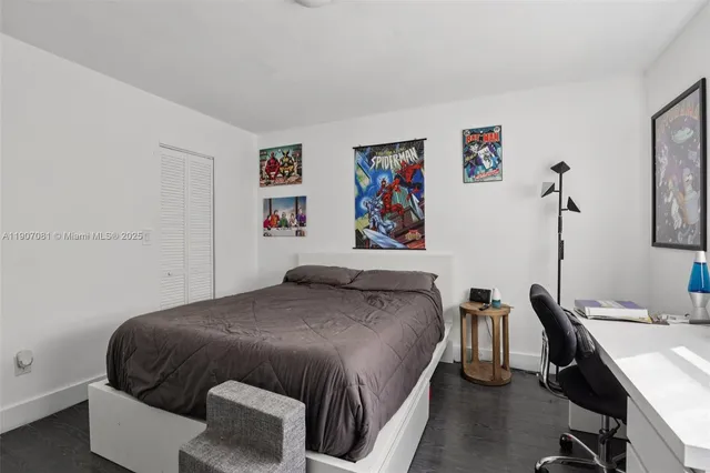 a bedroom with a bed and a desk