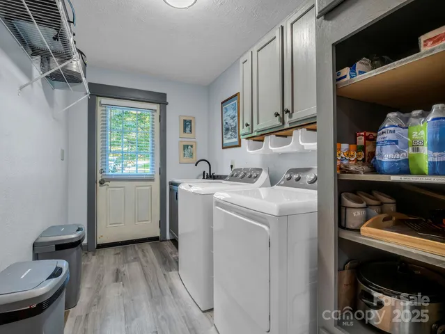 a view of storage and utility room with washer and dryer