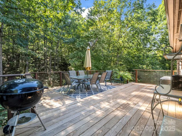 a view of a chairs and table in backyard
