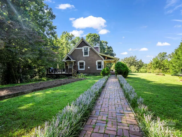 a front view of a house with yard