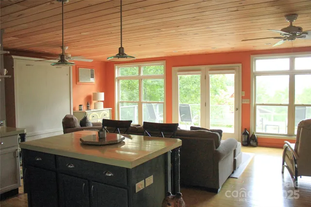 a dining room with a large window and couch