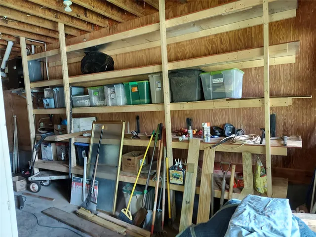 a view of a room with rack and furniture