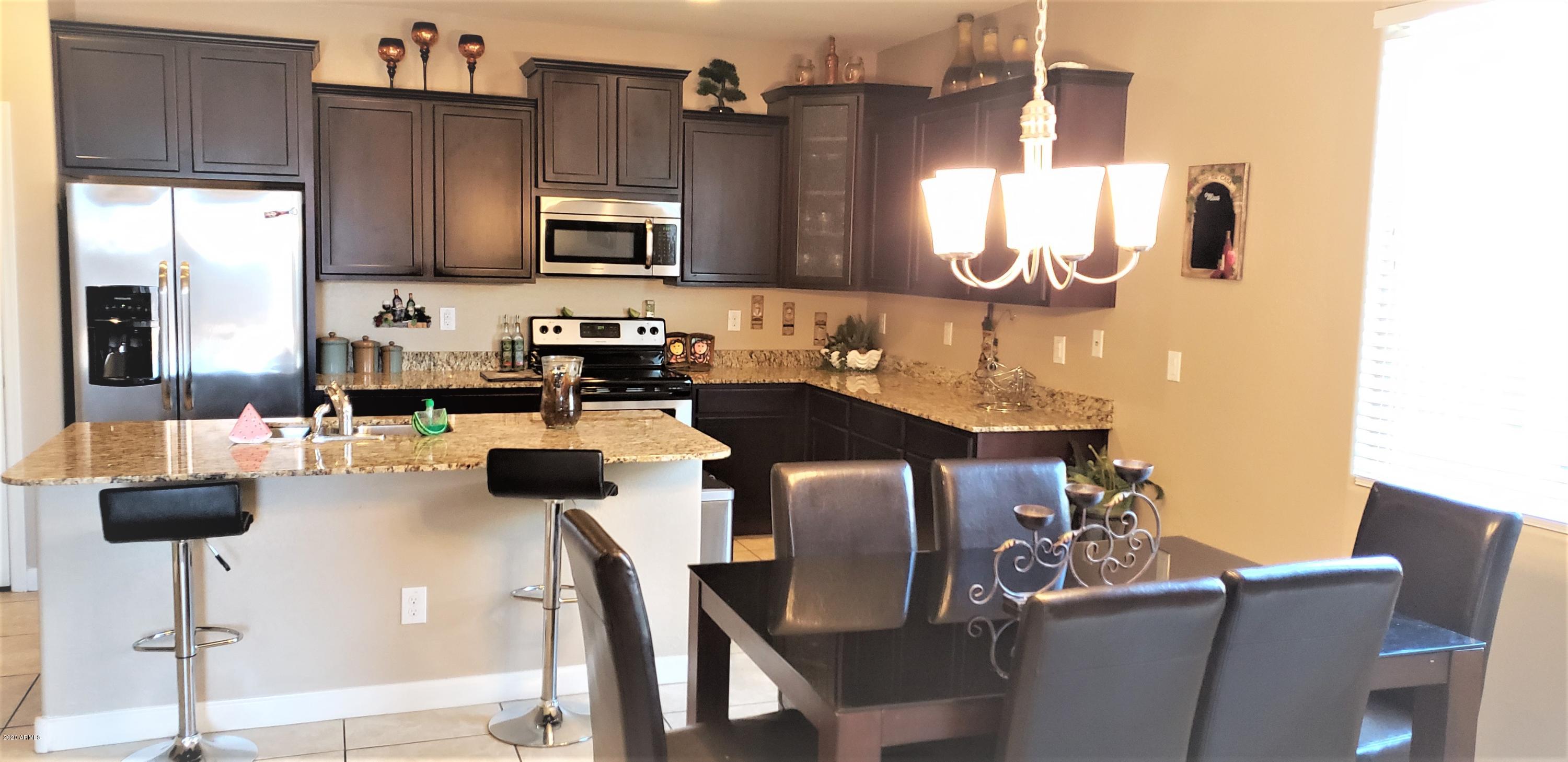 23857 West Ripple Road Buckeye, AZ 85326 - Photo 4 of 11 Kitchen-Dining area
