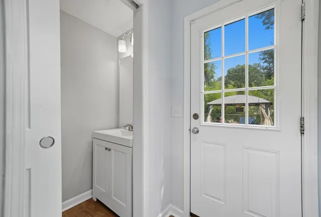 a bathroom with a window and a sink