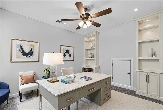 a workspace with furniture and window