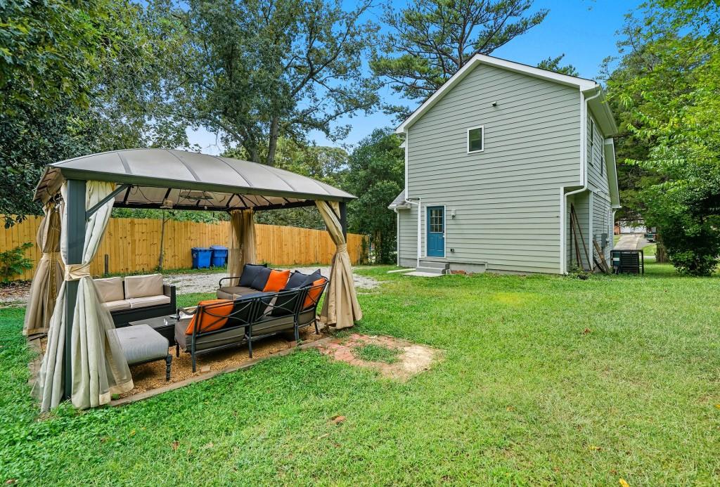 2490 Barge Road Southwest Atlanta, GA 30331 - Photo 22 of 27 a view of backyard with outdoor seating and trees
