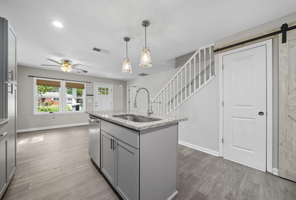 2490 Barge Road Southwest Atlanta, GA 30331 - Photo 9 of 27 a kitchen with stainless steel appliances granite countertop a stove and a refrigerator