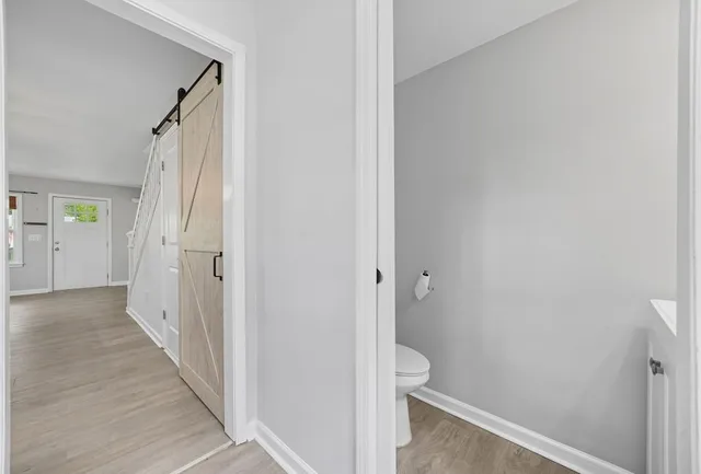 a view of a bathroom from a hallway