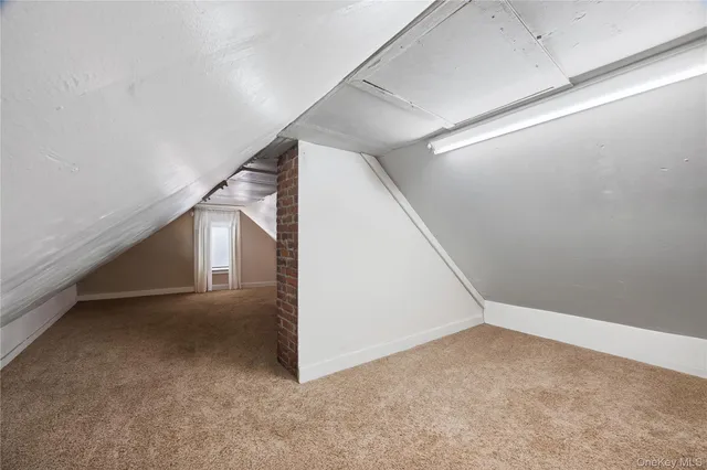 a room with furniture and a hallway