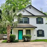 a front view of a house with garage