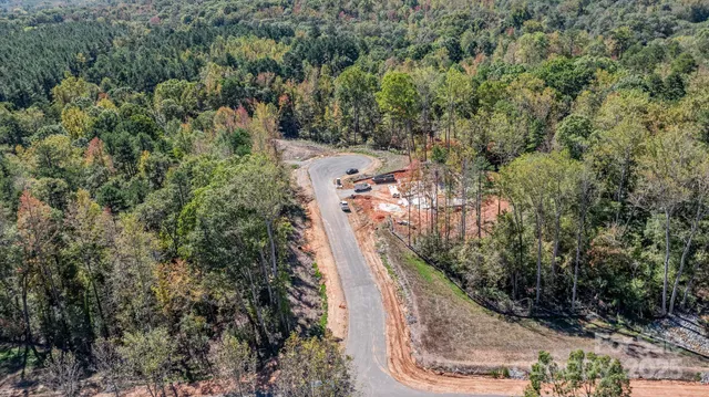 a view of a sign that is sitting on the side of the road