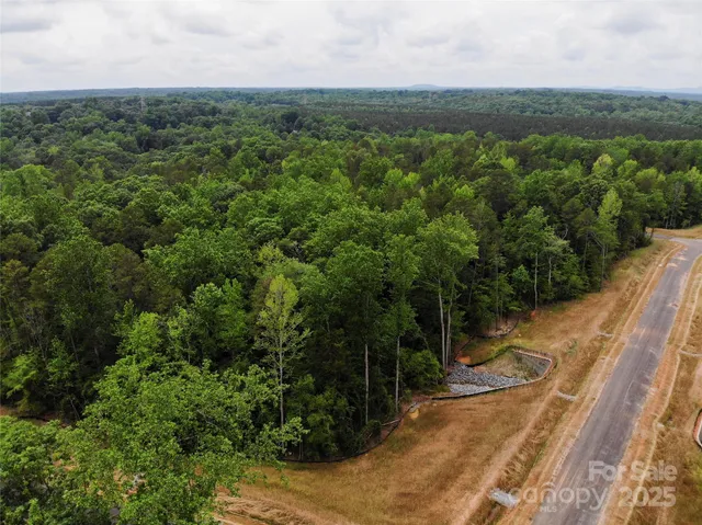 a view of a lake with houses in the back
