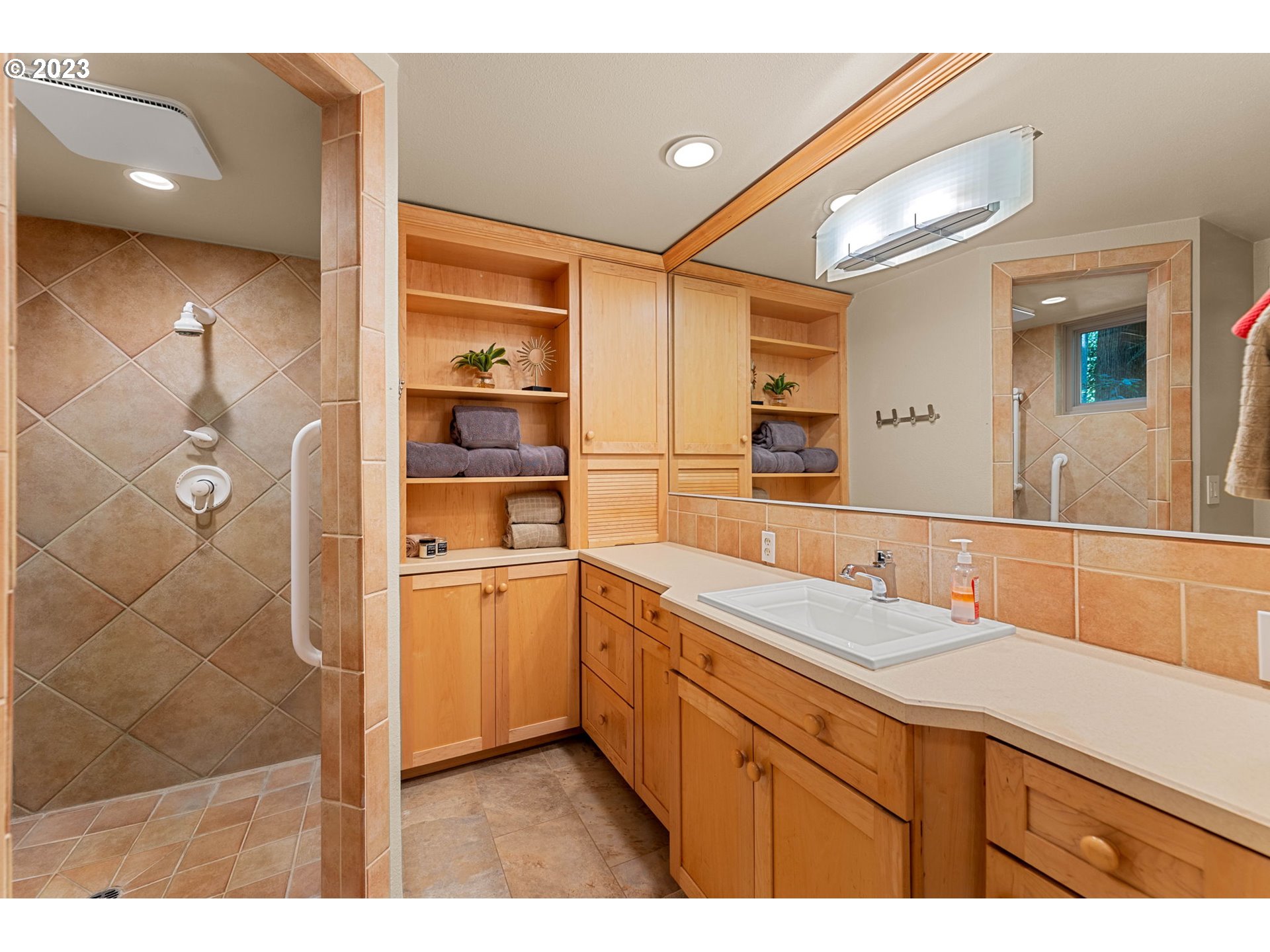 3111 Northwest 199th Street Ridgefield, WA 98642 - Photo 28 of 32 a bathroom with a sink and a mirror