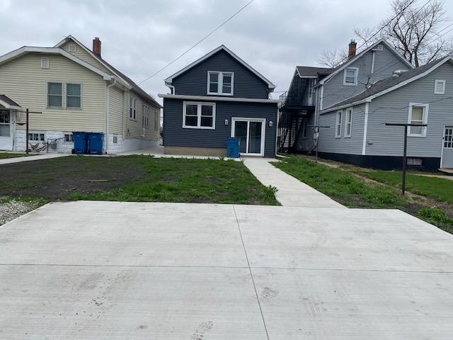 509 West Erie Street Spring Valley, IL 61362 - Photo 18 of 19 a front view of a house with a yard and garage