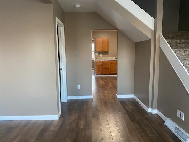509 West Erie Street Spring Valley, IL 61362 - Photo 4 of 19 a view of empty room with wooden floor and kitchen