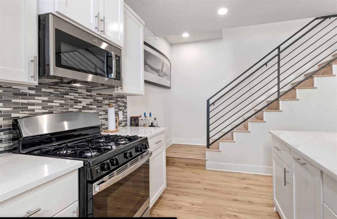 7407 Bethune Avenue, Unit 2 Austin, TX 78752 - Photo 11 of 30 a stove top oven sitting inside of a kitchen