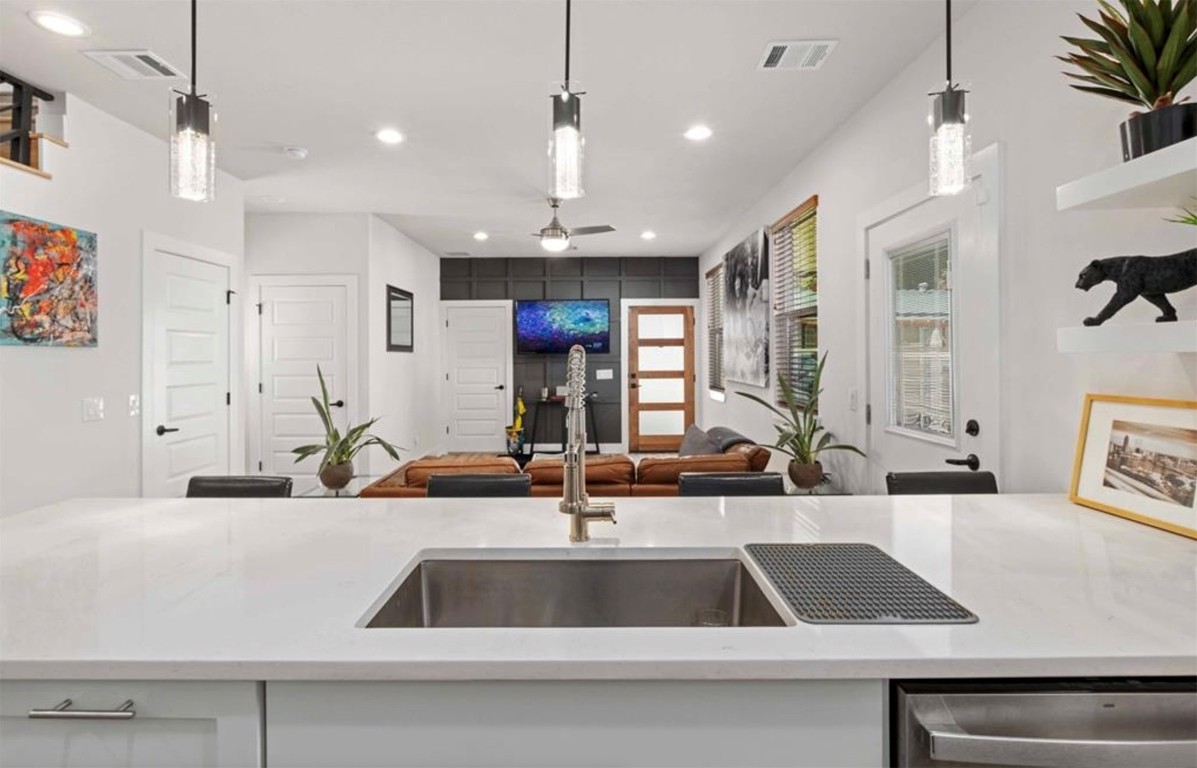 7407 Bethune Avenue, Unit 2 Austin, TX 78752 - Photo 12 of 30 a view kitchen with kitchen island a sink and a counter top space