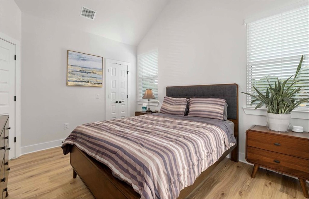 7407 Bethune Avenue, Unit 2 Austin, TX 78752 - Photo 13 of 30 a bedroom with a bed and a potted plant