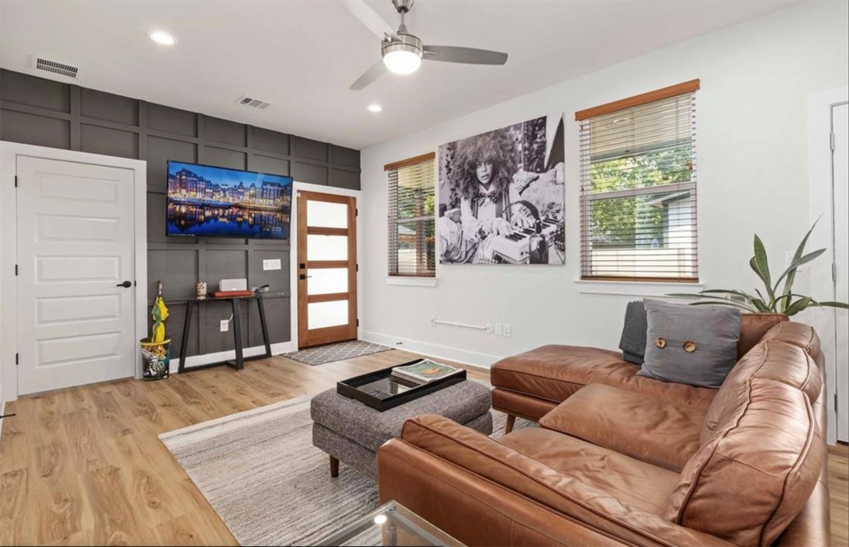 7407 Bethune Avenue, Unit 2 Austin, TX 78752 - Photo 8 of 30 a living room with furniture a wooden floor and a window