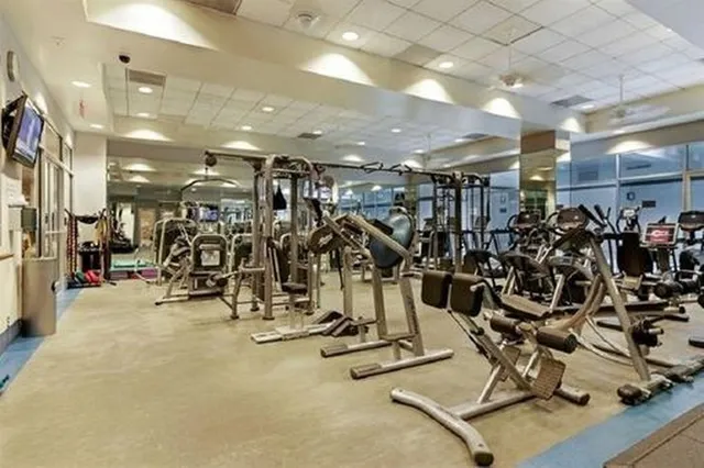 a view of a house with swimming pool and sitting area