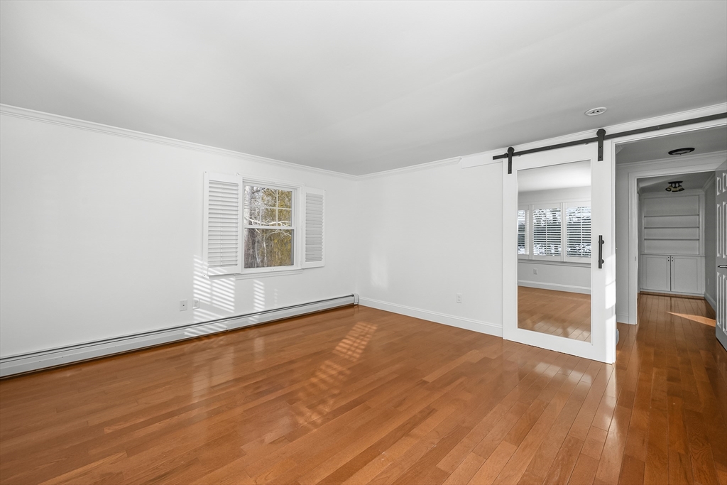 103 Pine Tree Drive Barnstable, MA 02632 - Photo 15 of 42 wooden floor in an empty room with a window