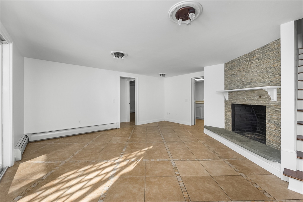 103 Pine Tree Drive Barnstable, MA 02632 - Photo 19 of 42 a view of an empty room with a fireplace
