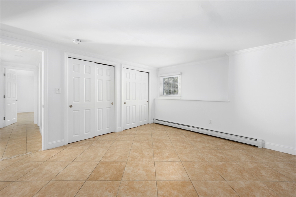 103 Pine Tree Drive Barnstable, MA 02632 - Photo 22 of 42 an empty room with an entryway