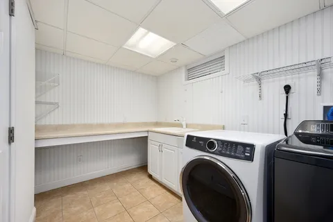 a view of storage and utility room with washer and dryer