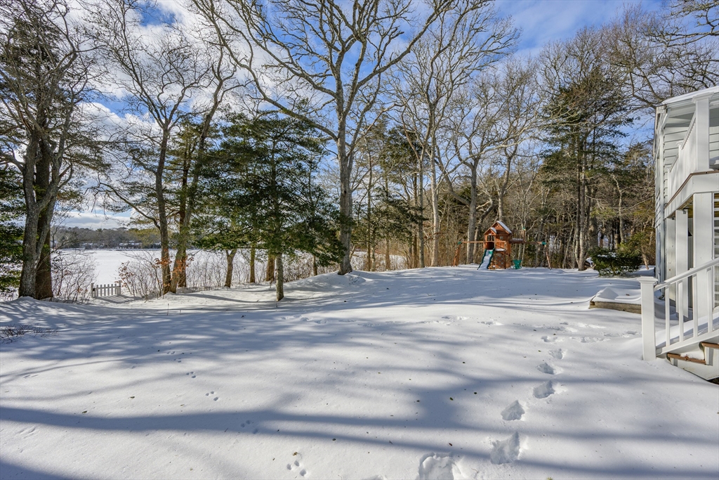 103 Pine Tree Drive Barnstable, MA 02632 - Photo 30 of 42 a view of road with trees