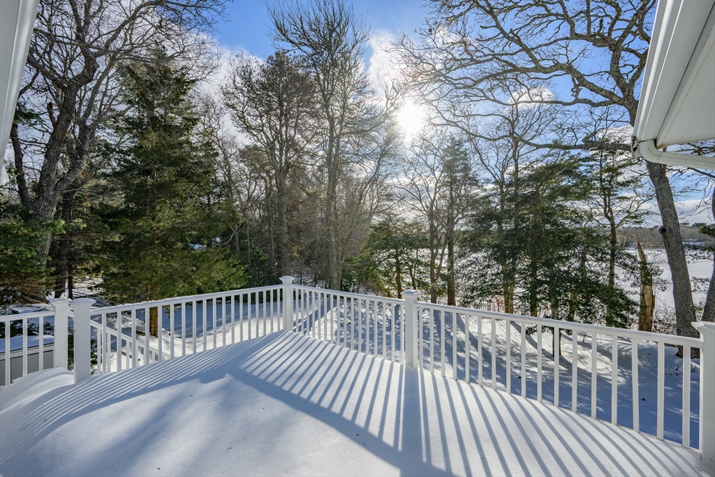 103 Pine Tree Drive Barnstable, MA 02632 - Photo 34 of 42 a view of a balcony with wooden floor and fence