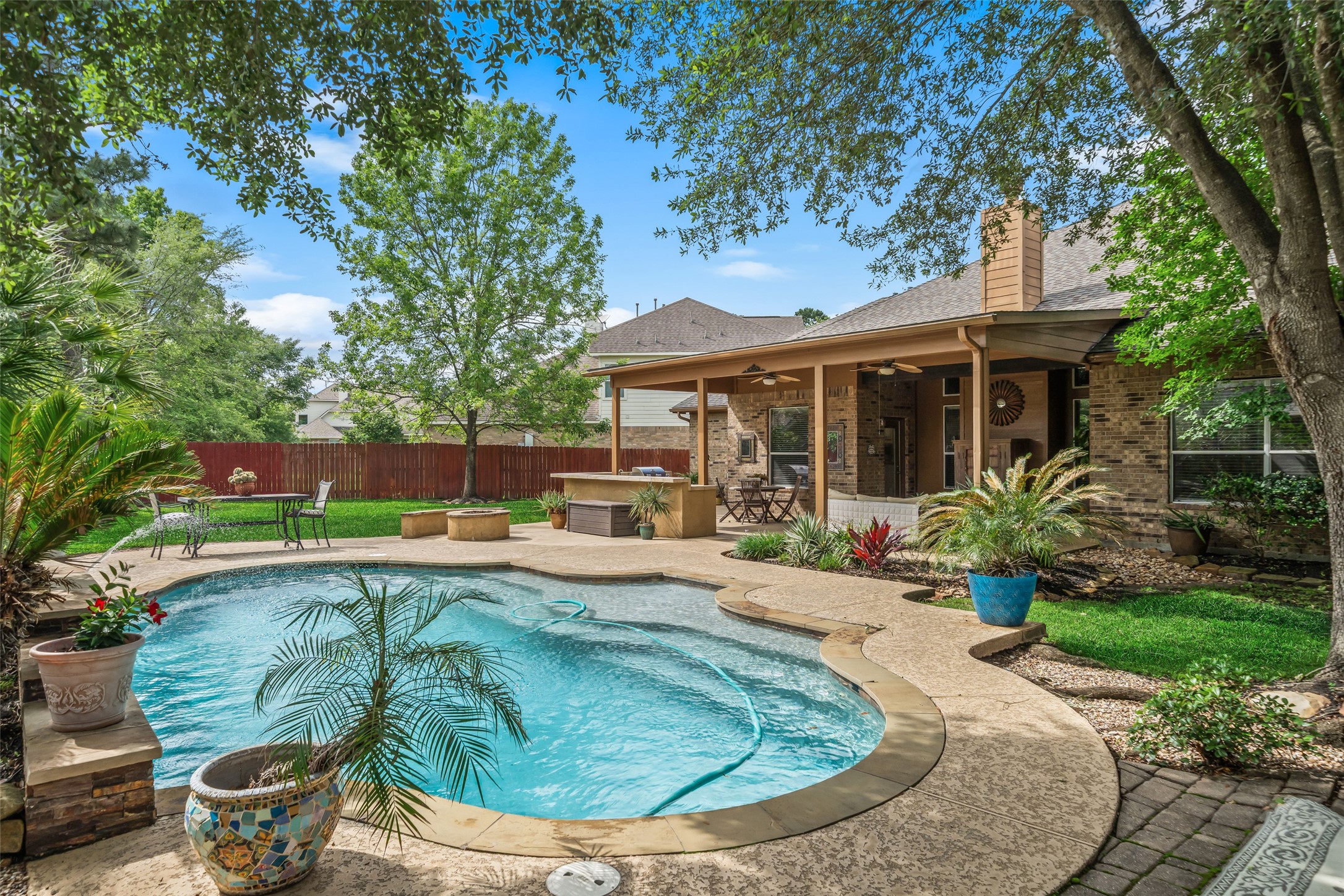 6407 Ashley Manor Drive Spring, TX 77389 - Photo 38 of 41 a view of a house with pool fire pit and chairs
