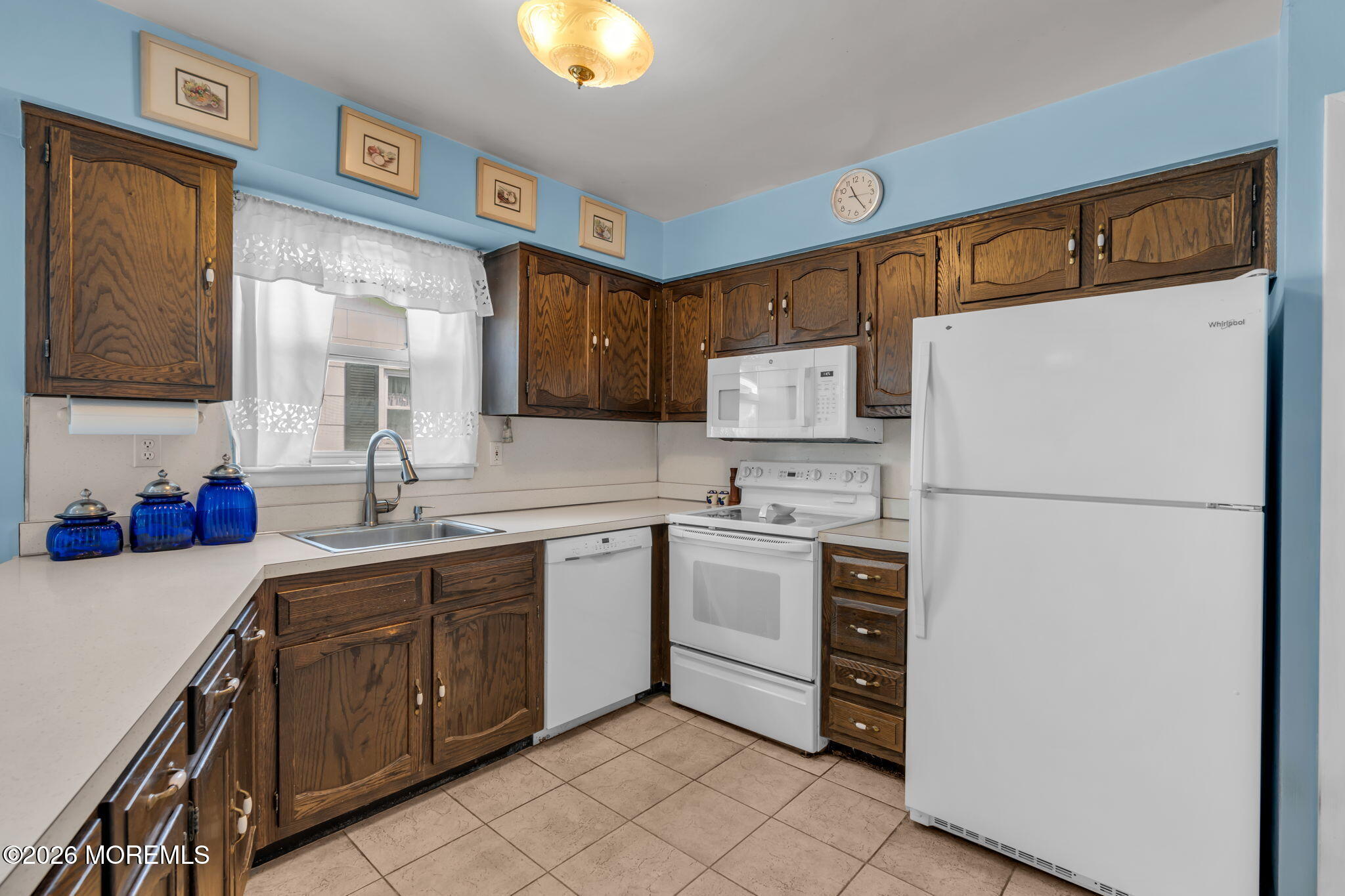 67 Blake Circle Brick, NJ 08724 - Photo 17 of 34 a kitchen with appliances a sink and lots of cabinets