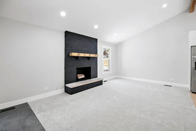 an empty room with a fireplace
