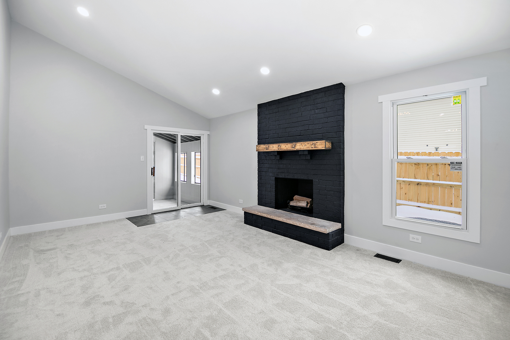 1623 East Street Lockport, IL 60441 - Photo 13 of 31 an empty room with fireplace and windows