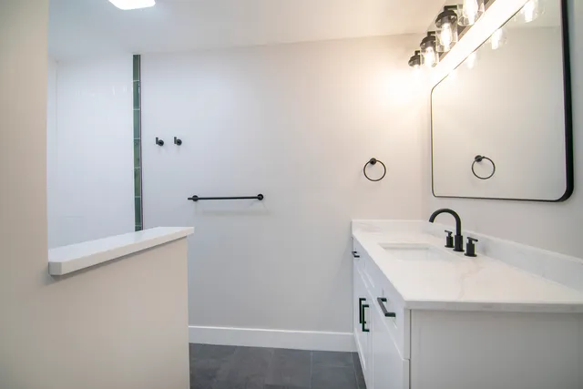 a bathroom with a sink and mirror
