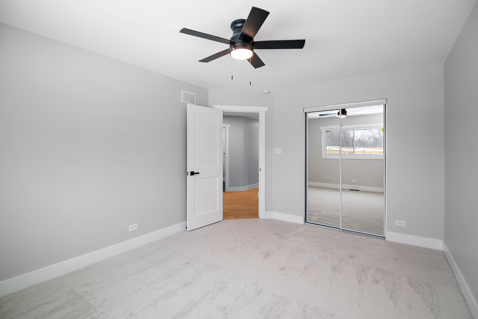1623 East Street Lockport, IL 60441 - Photo 27 of 31 an empty room with closet and a ceiling fan