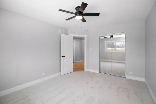 a view of an empty room with windows